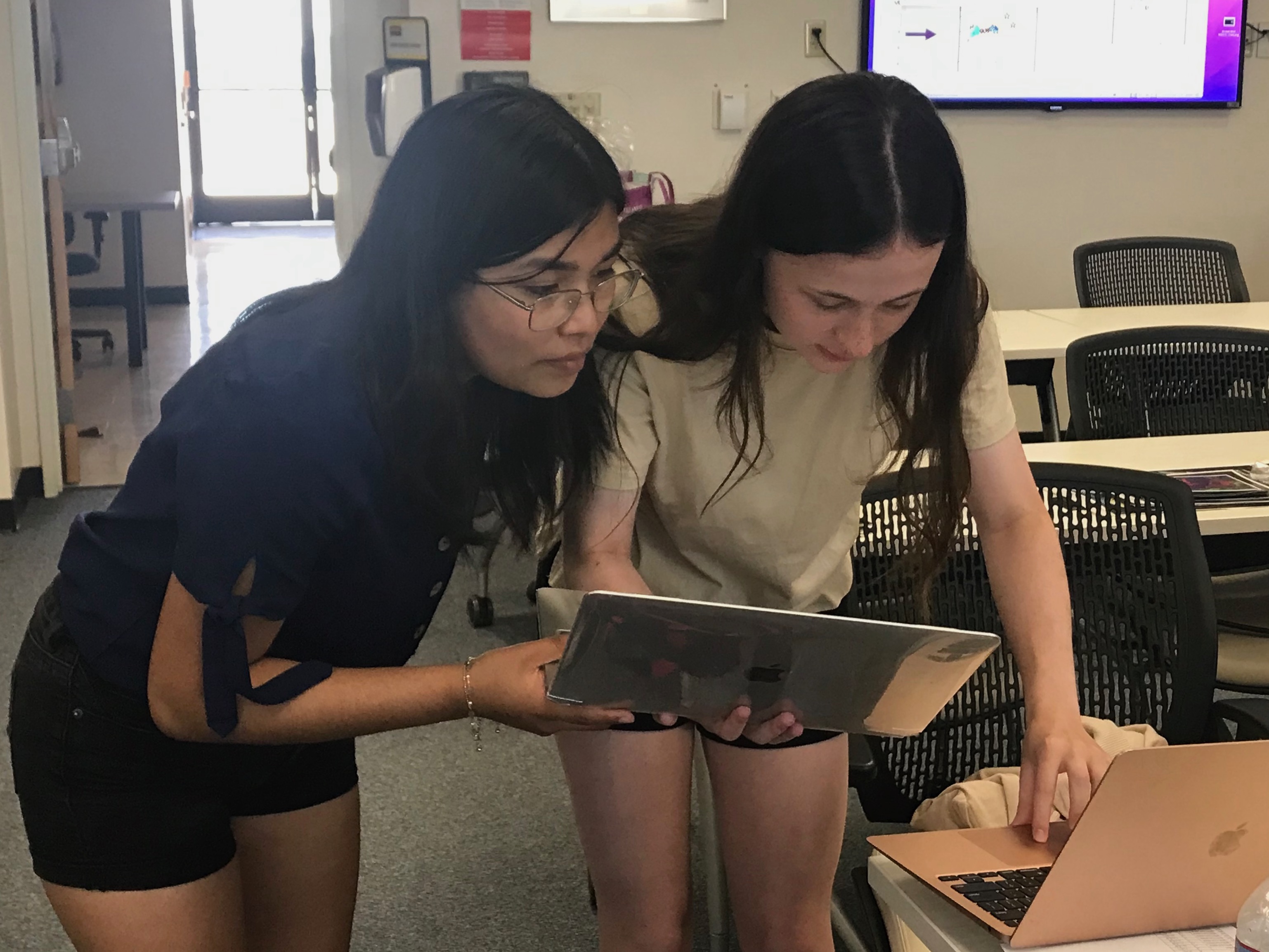 "Wait, what did you get for that calculation?” Two students from Severn School (Severna Park, Maryland) work on creating spectral energy distributions for stars in June 2023. Image credit: Luisa Rebull